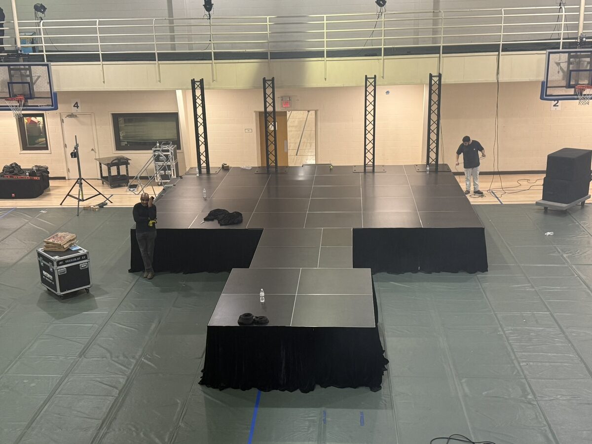 Stage build with truss in gymnasium