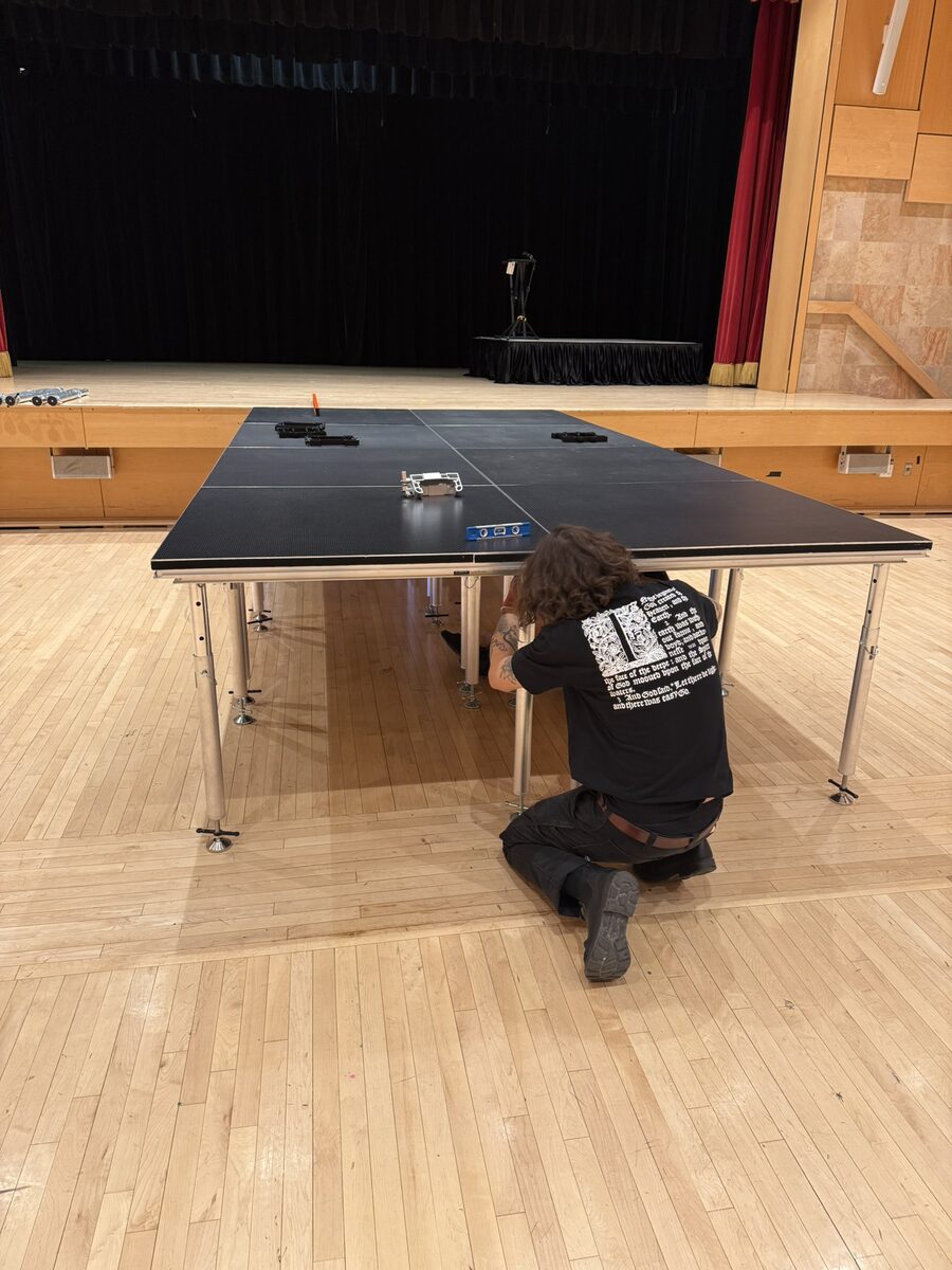 Technician assembling stage deck