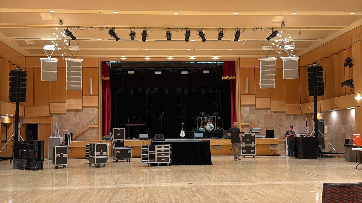 Concert venue stage with sound and lighting setup